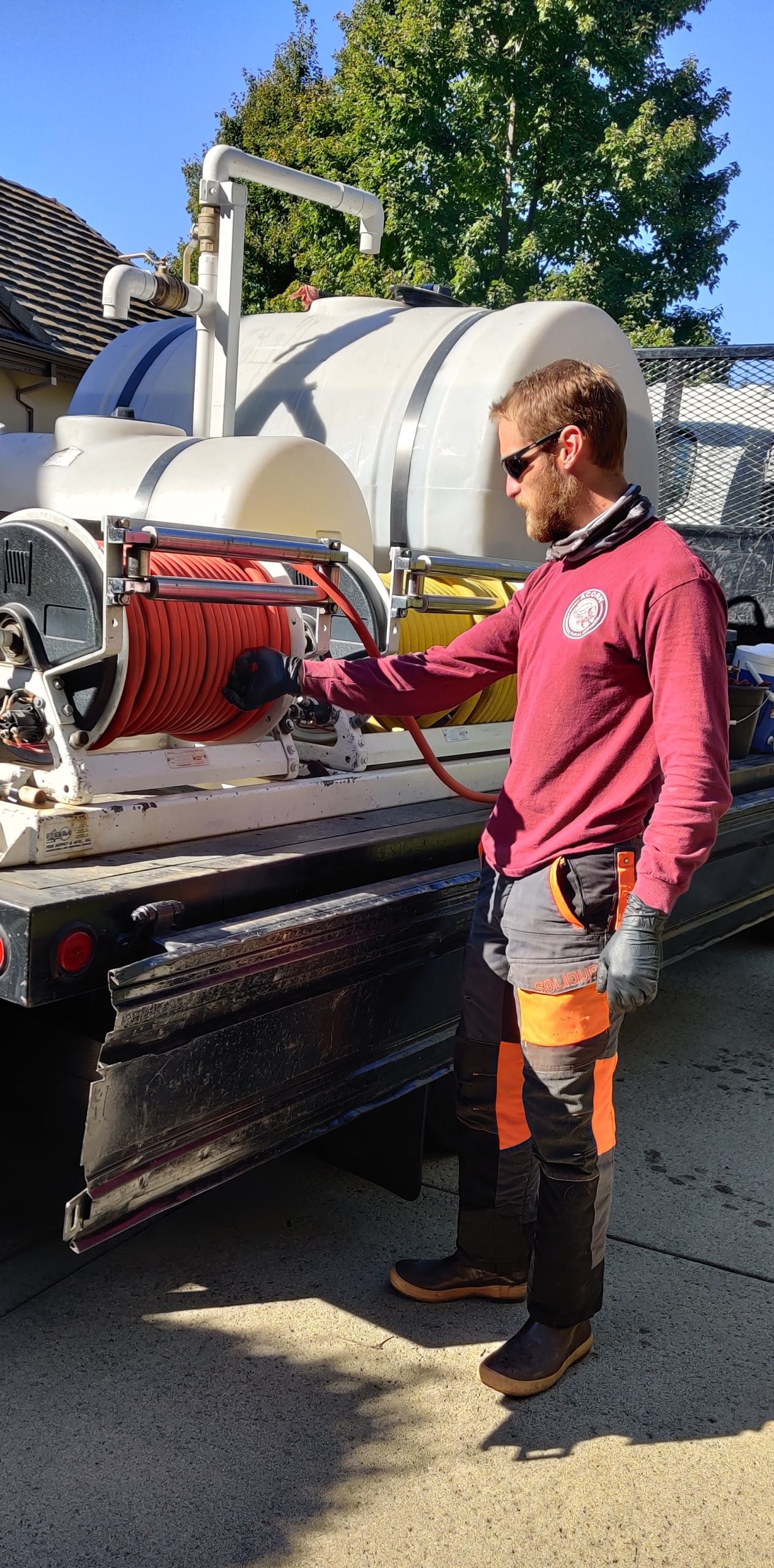 A crew member before tree fertilization in Sacramento, CA